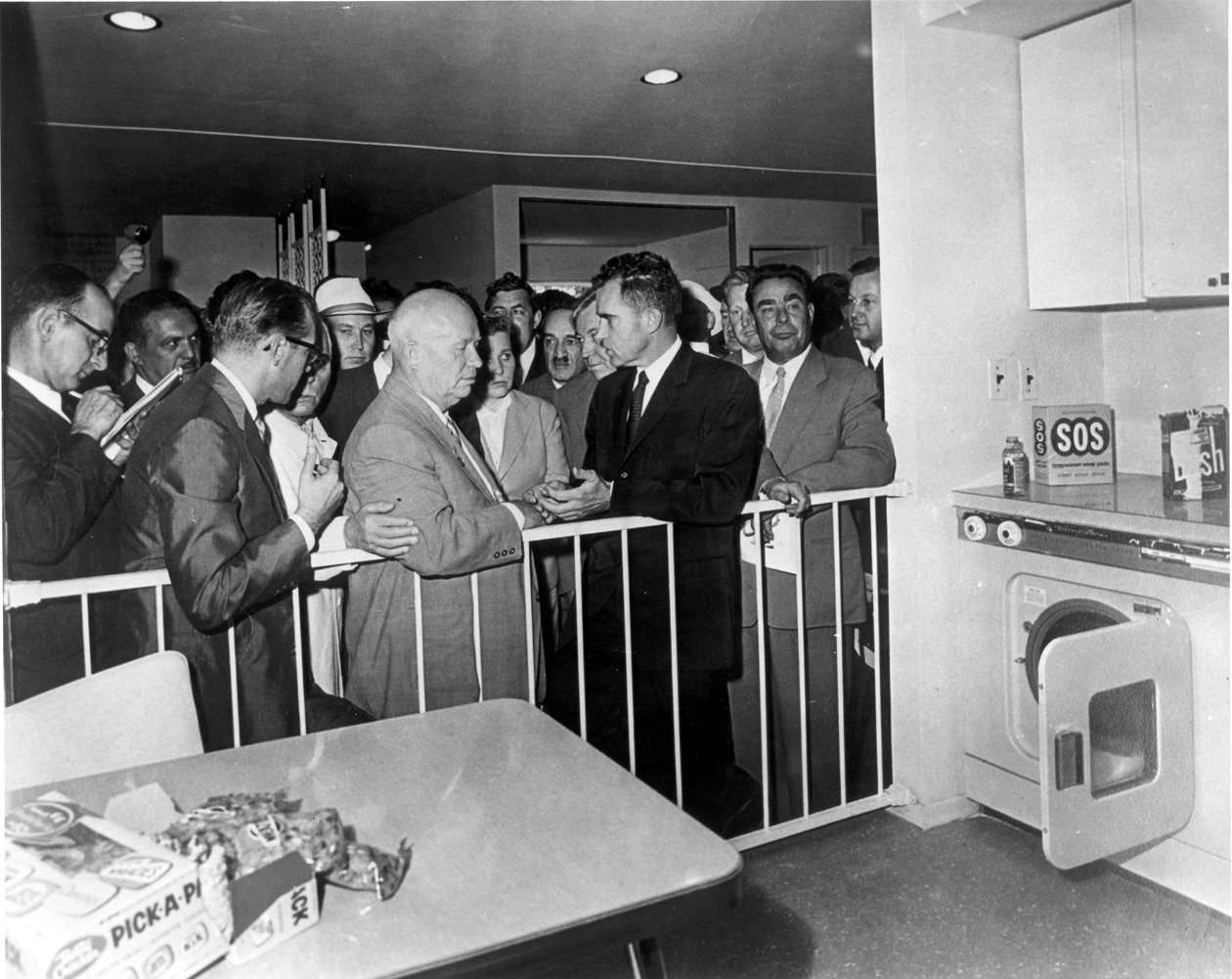 Nikita Krushchev and Richard Nixon preparing to enter the Kitchen Debate.