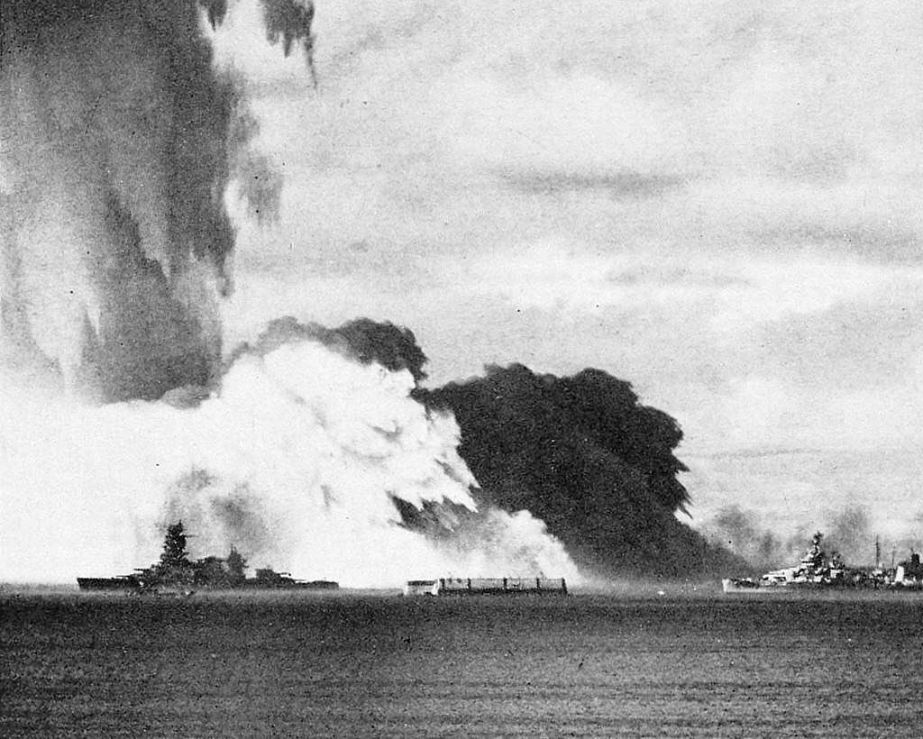 The ship (left) during the Baker detonation. 