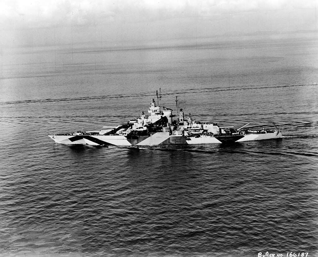 USS California underway in 1944, donning a camouflage paint job. 