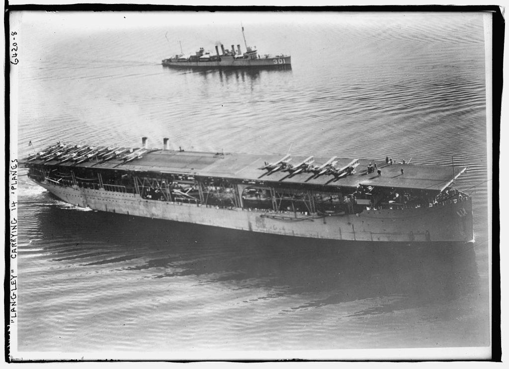 USS Langley with fourteen aircraft on her deck. 