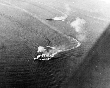 The Japanese battleship Fusō under attack from US aircraft during the Battle Of Surigao Strait.