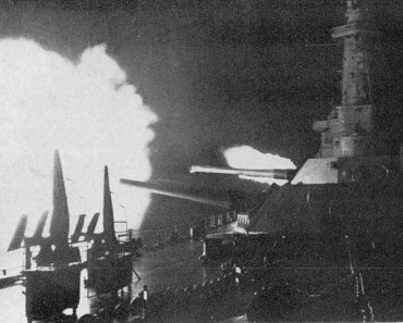 USS Washington firing at night during the Naval Battle of Guadalcanal.