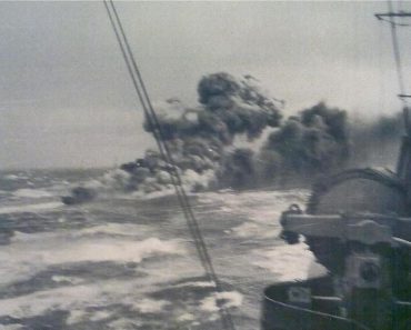 The wreck of HMS Glowworm burning.