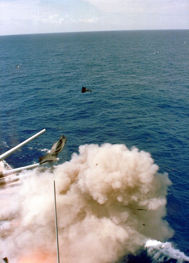 A view of the explosion from the bridge. Pieces of the turret can be seen in the air. 